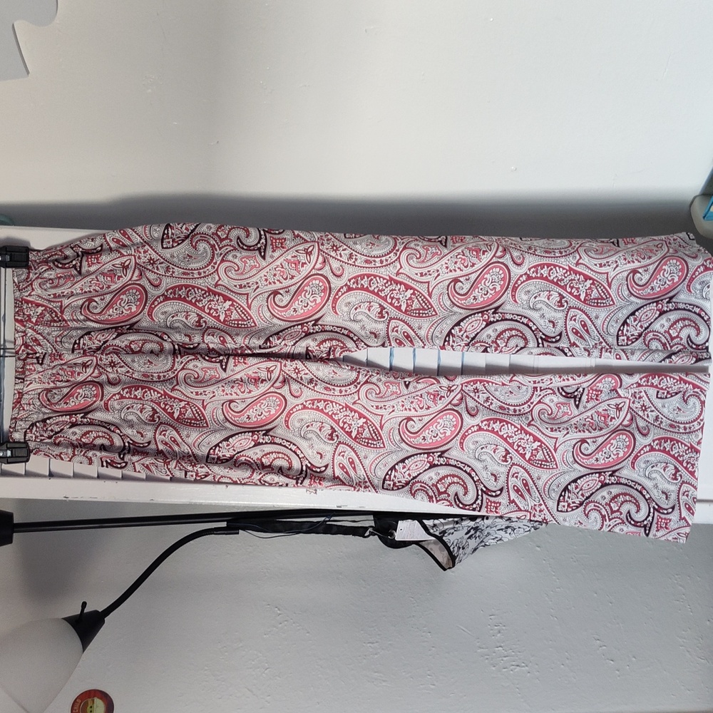 Pink and black Paisley stretch pants with flare leg.